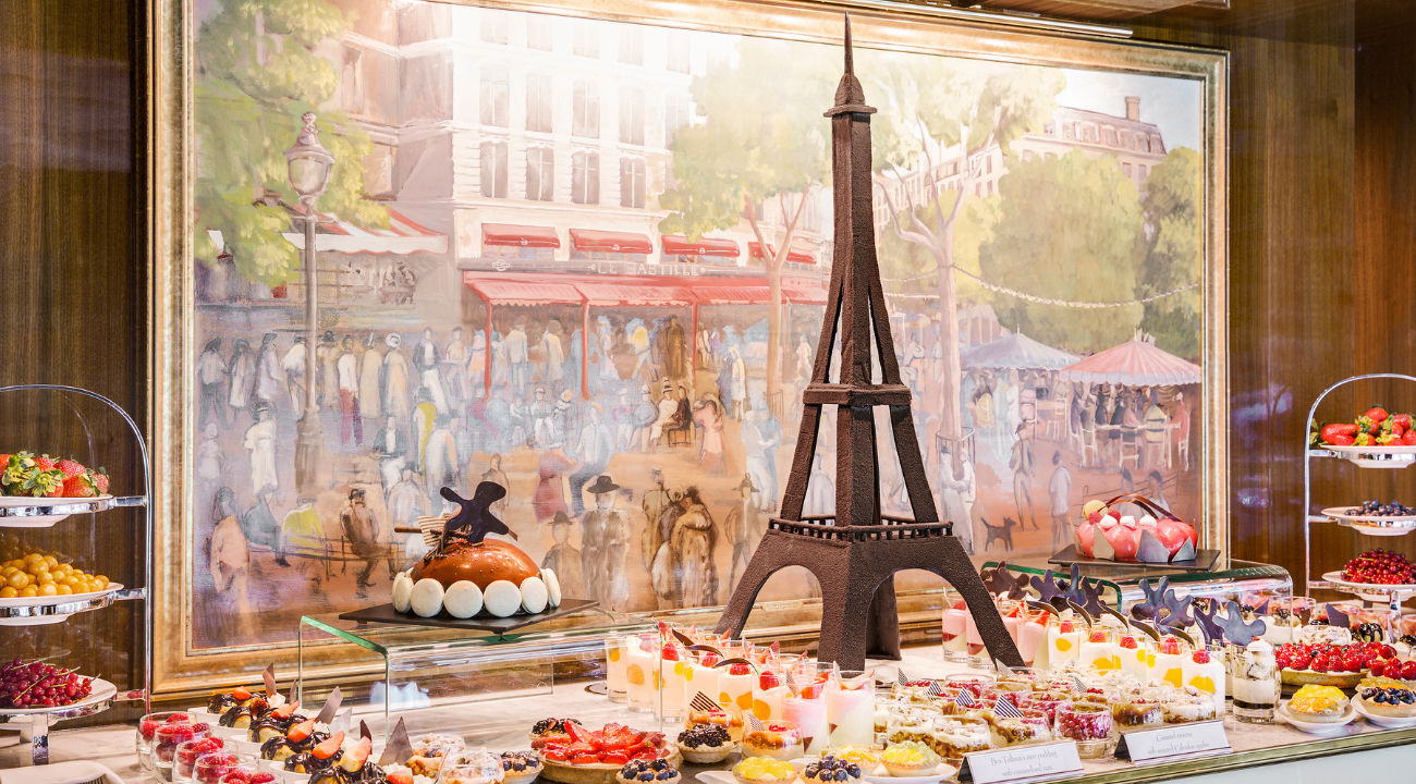 A decadent display of classic French patisserie, including macarons, éclairs, and tartes au citron. All included on the Paris and Normandy river cruise.