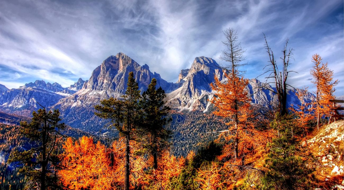 Best time to visit Europe in Autumn. Dolomites Italy in autumn with colourful forests