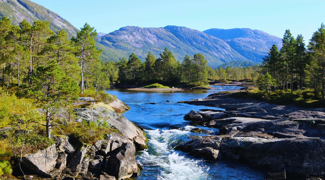 Serene view of Norwegian fjord surrounded by mountains during spring in Europe