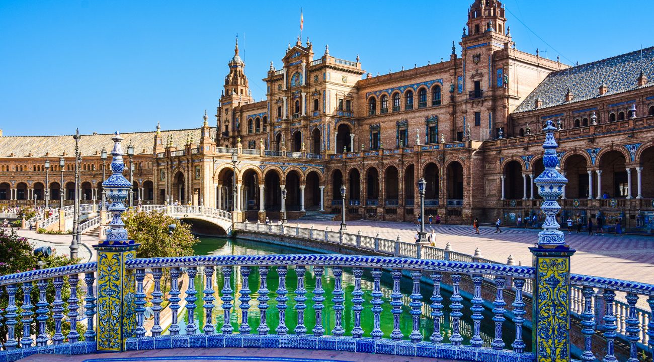 Plaza de España in Seville with ornate architecture and canal during spring in Spain