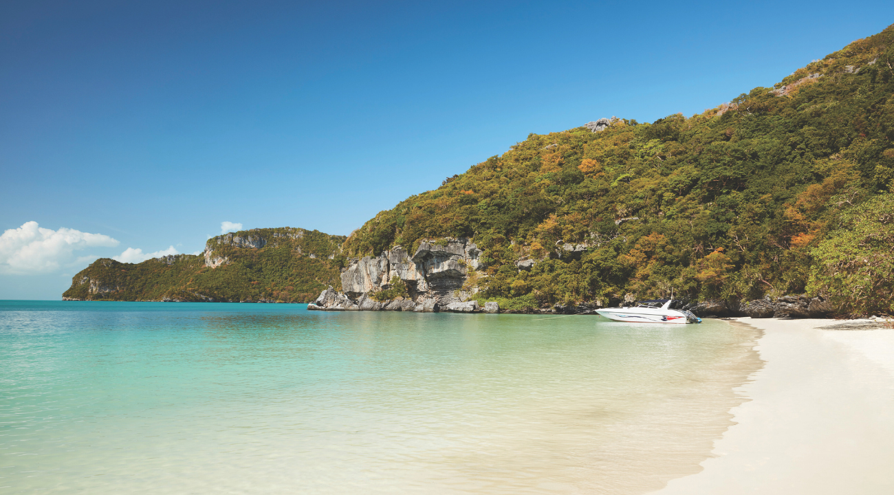 Turquoise waters and tropical coastline of Langkawi, Malaysia, seen from a boat excursion.