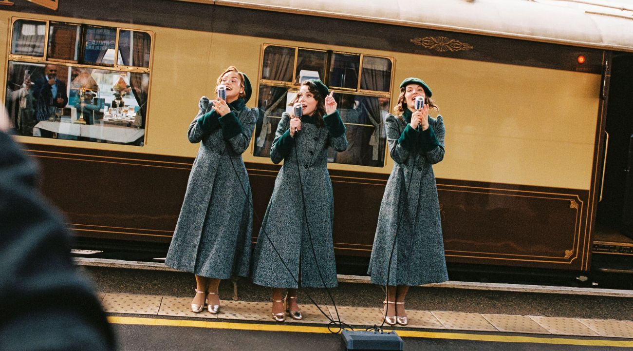 Guests in period attire outside the British Pullman