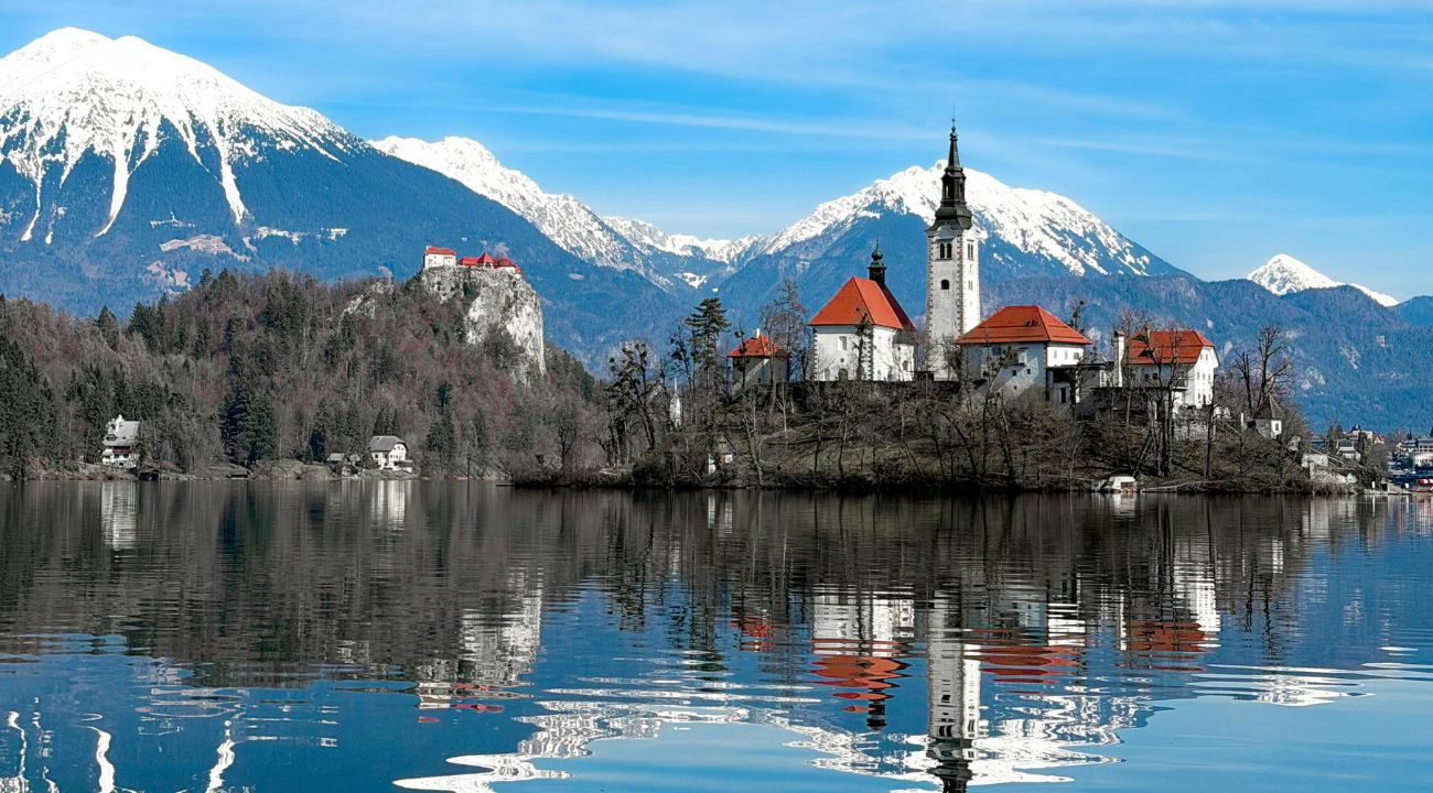 Lake Bled in Slovenia surrounded by mountains, a scenic touring holiday destination