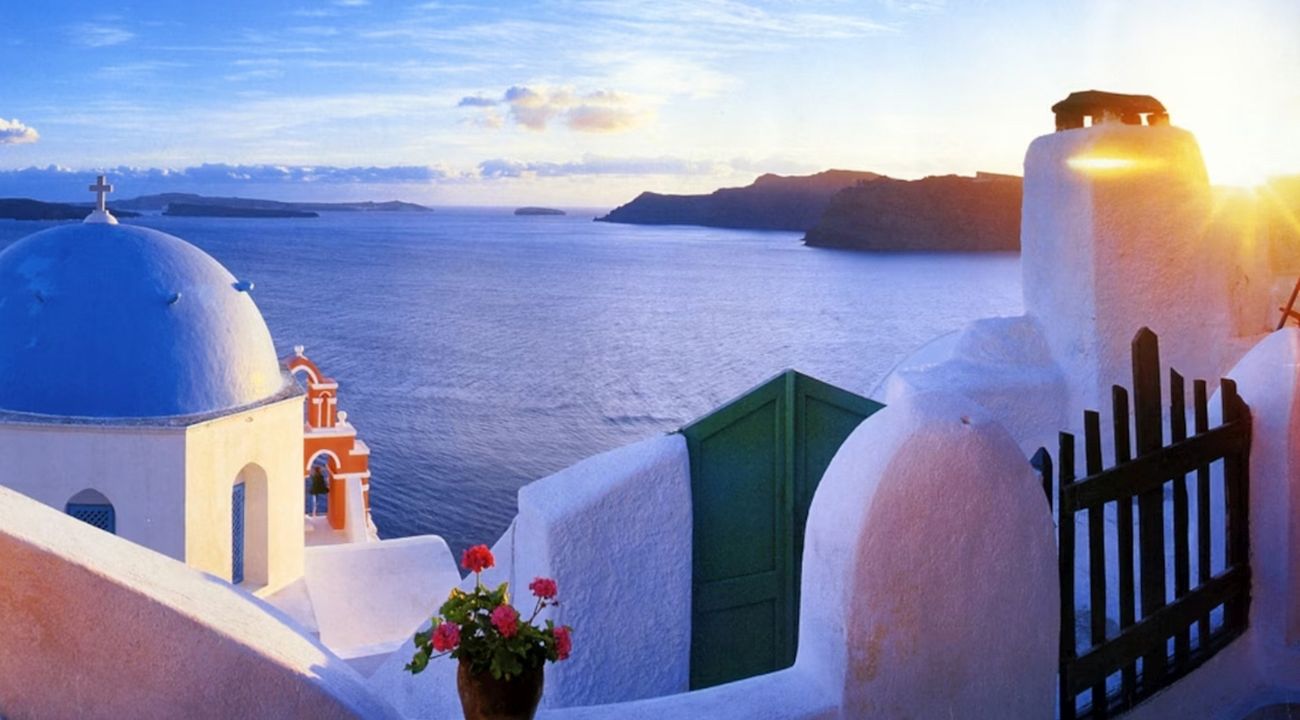 Greek coastal buildings overlooking the sea, a popular destination for touring holidays