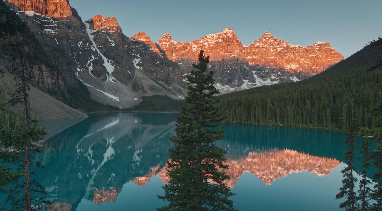 Moraine Lake at sunrise in Banff National Park, a top scenic touring holiday destination in Canada