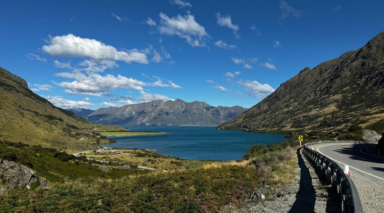 Lake Hawea in New Zealand with mountain backdrop, a scenic touring holiday destination