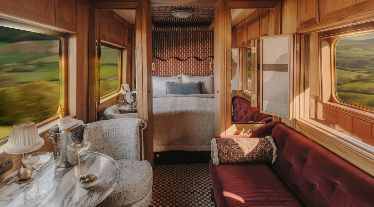 Luxury suite with separate seating area and sleeping space on board a train