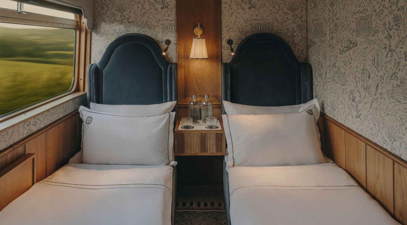 Twin cabins converted into sleeping arrangement for night travel