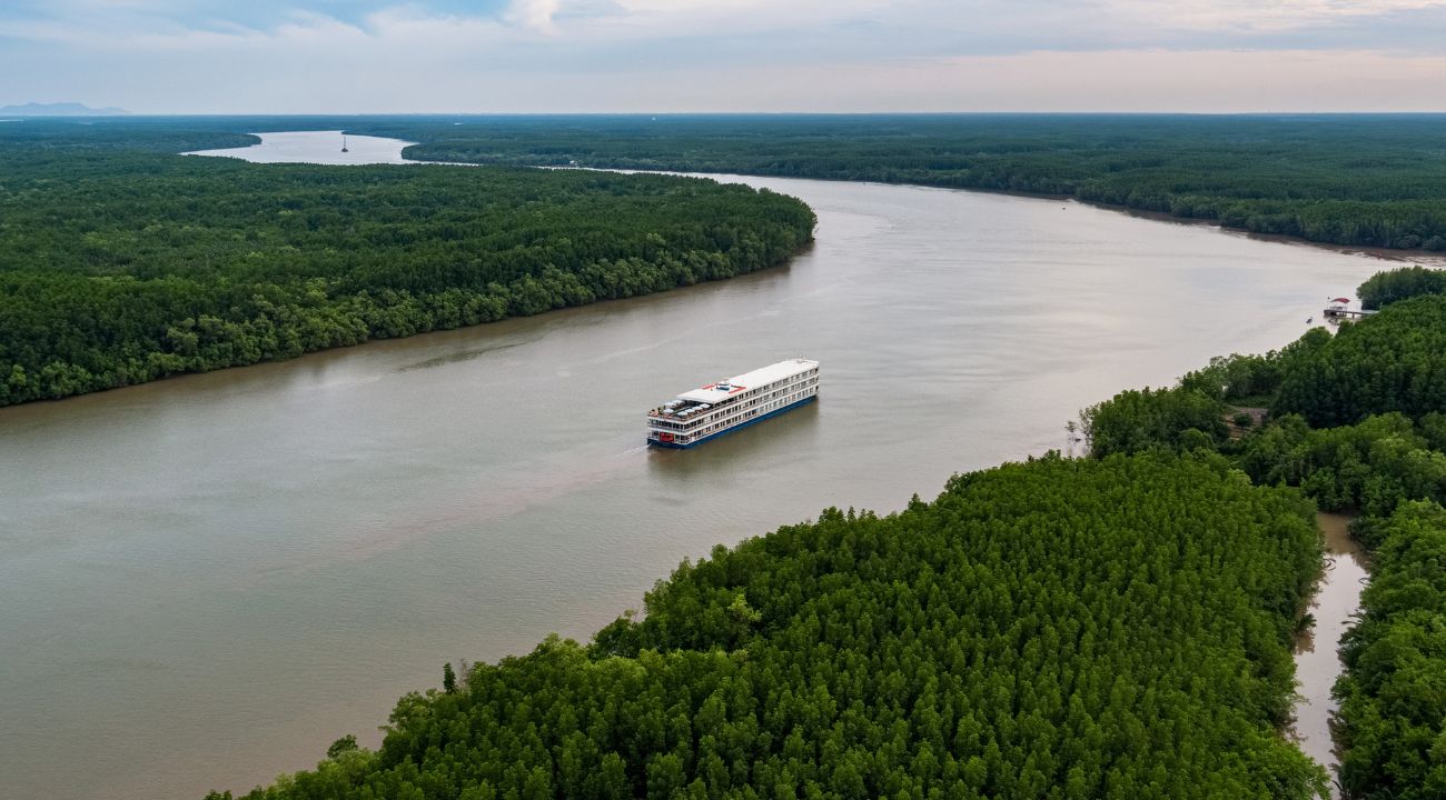 Luxury river cruise ship sailing on the Mekong River in Southeast Asia