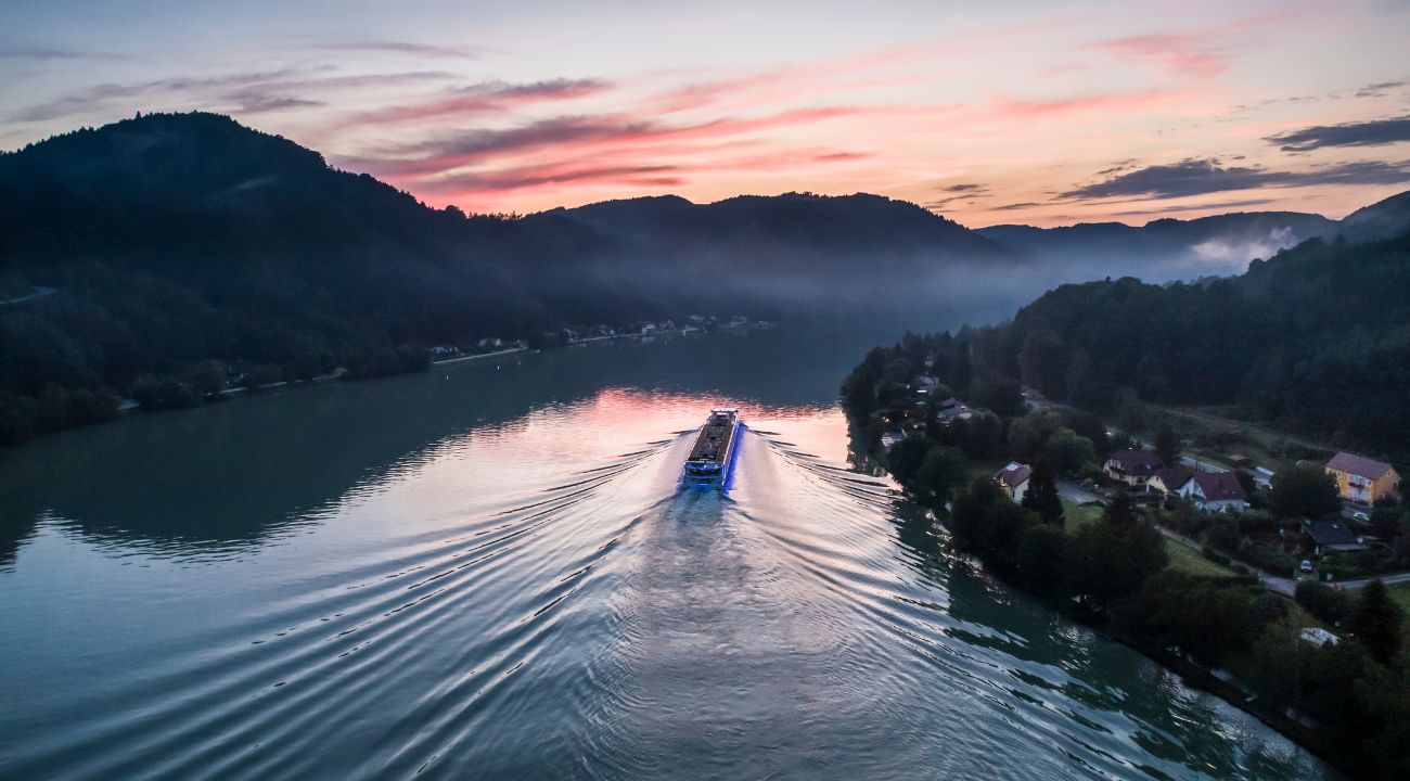 Scenic river cruise ship sailing along a European waterway such as the Rhine or Danube