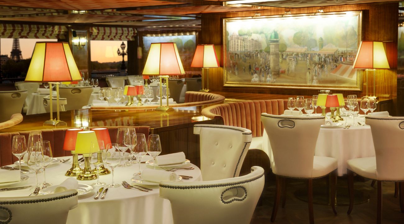Elegant dining experience onboard a river cruise ship with panoramic river views