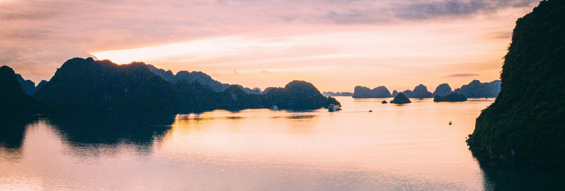 Asia river cruise holiday showcasing scenic river landscapes along Ha Long Bay with traditional boats, riverside villages and cultural scenery.