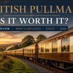 British Pullman luxury train travelling through the English countryside at sunset during a British Pullman review and luxury rail journey in 2026